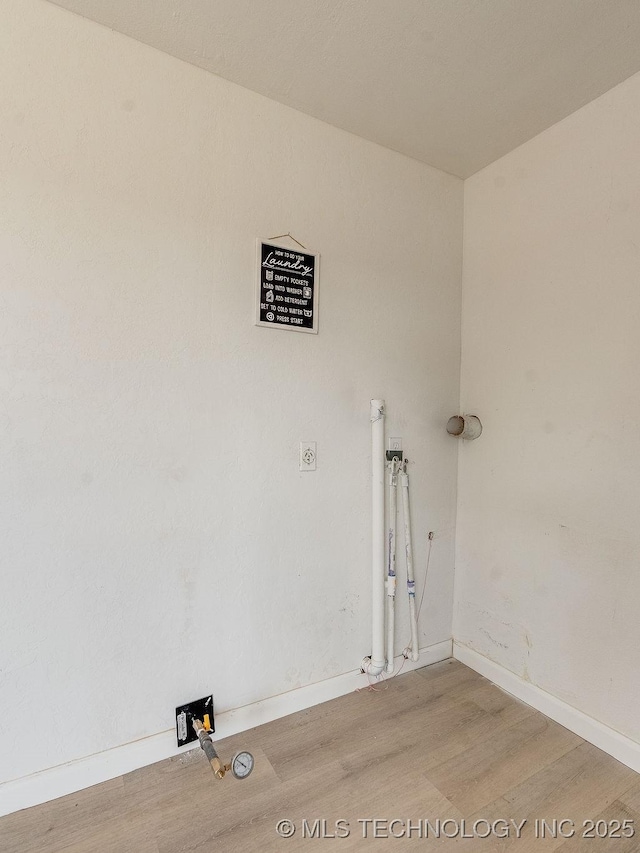 washroom with wood-type flooring