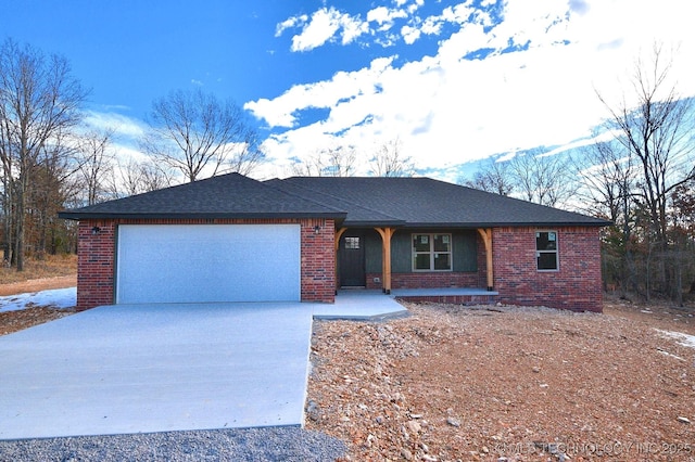 ranch-style home featuring a garage