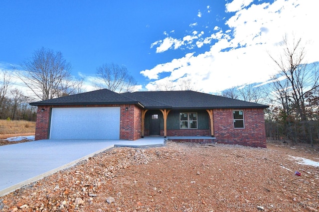 ranch-style home featuring a garage