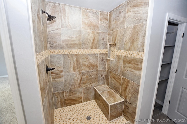 bathroom featuring tiled shower