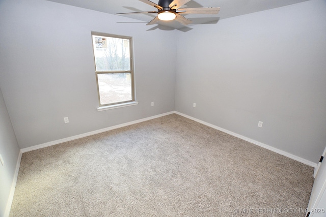 unfurnished room featuring ceiling fan and carpet flooring