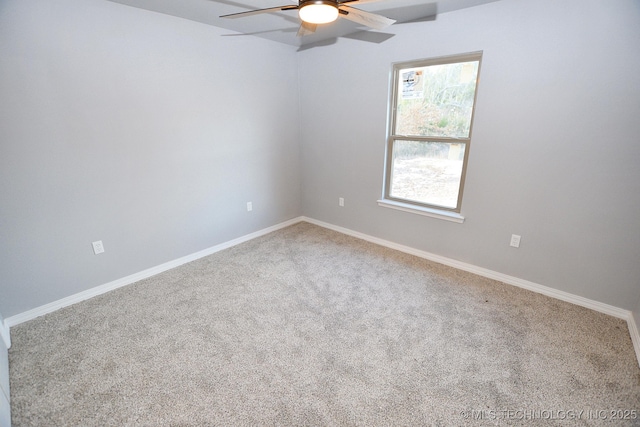 unfurnished room featuring ceiling fan and carpet