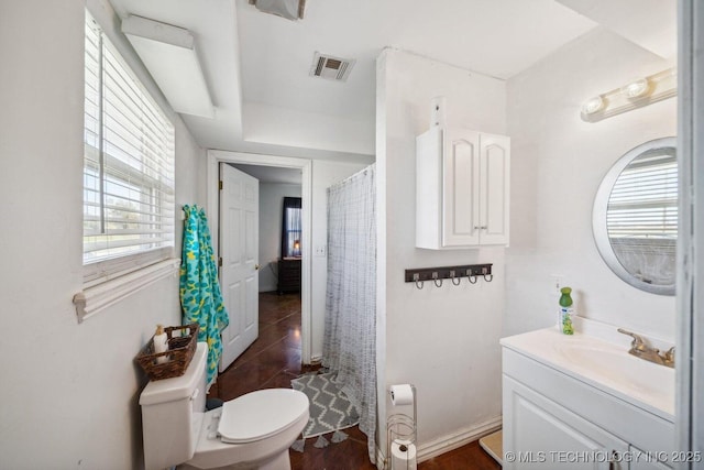 bathroom with toilet and vanity