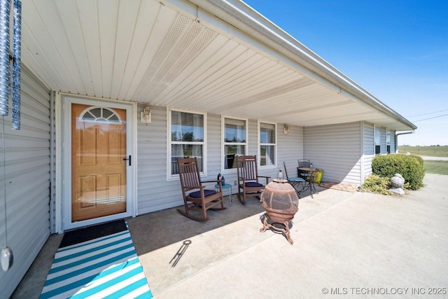 view of patio featuring an outdoor fire pit