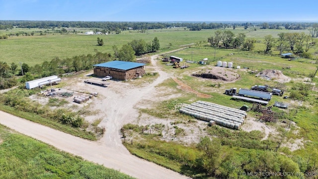 birds eye view of property with a rural view