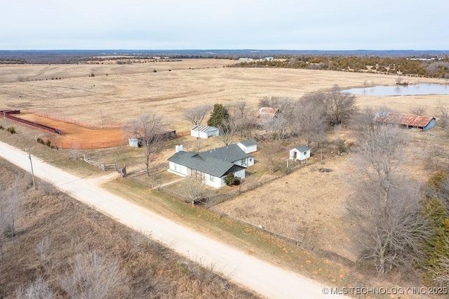 aerial view with a rural view and a water view