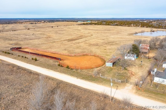 drone / aerial view with a rural view and a water view