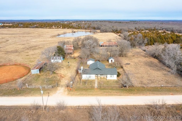 birds eye view of property with a rural view and a water view