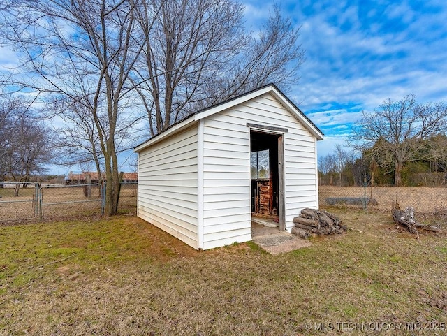 view of outbuilding with a yard