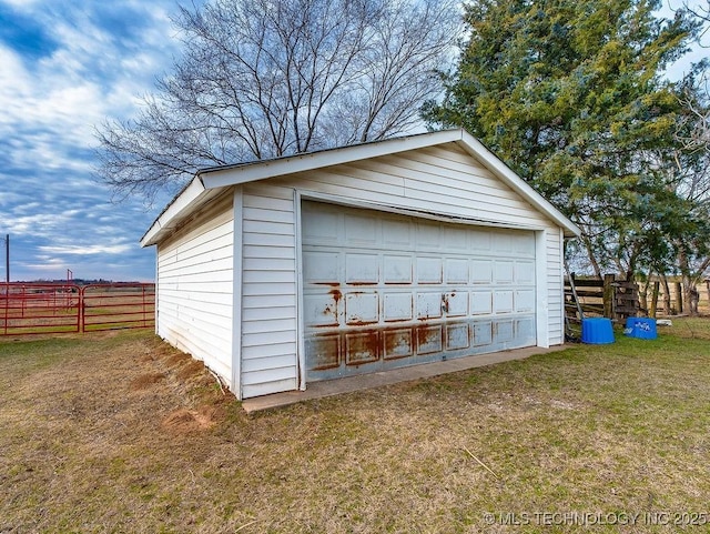 garage featuring a yard