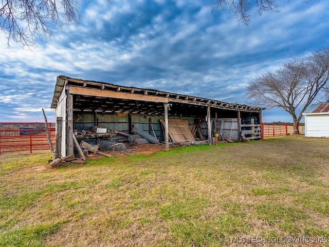 view of outdoor structure featuring a lawn