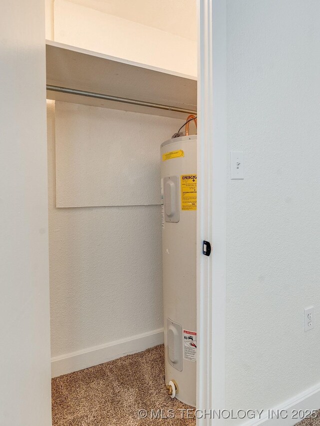 utility room featuring water heater