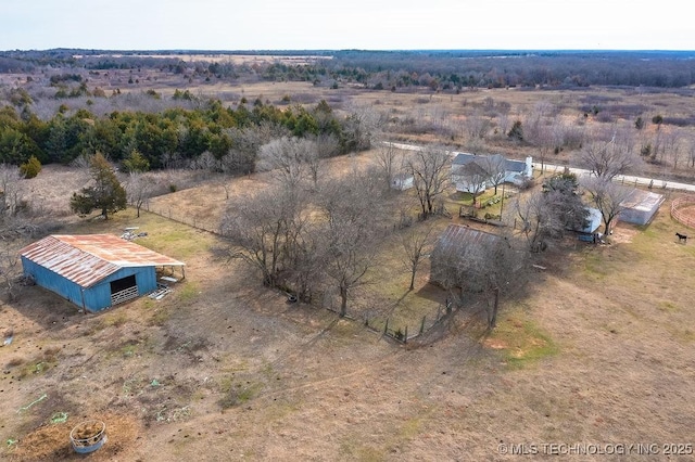 birds eye view of property featuring a rural view