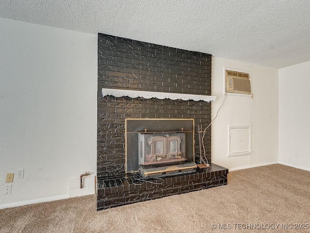 room details with carpet floors, a textured ceiling, a wall mounted AC, and a fireplace