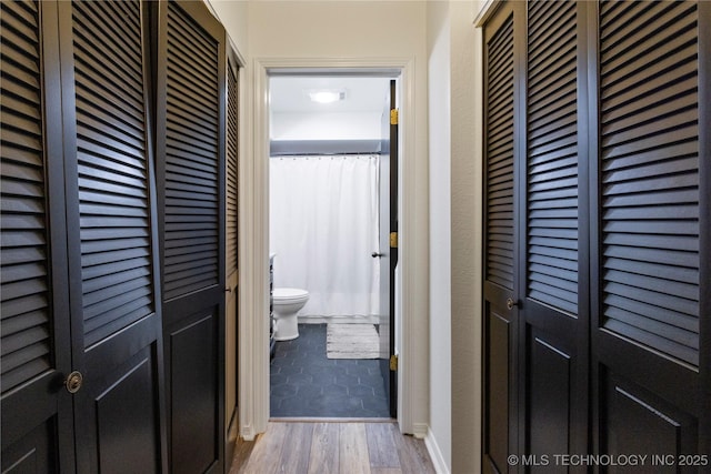 hallway with light wood-type flooring