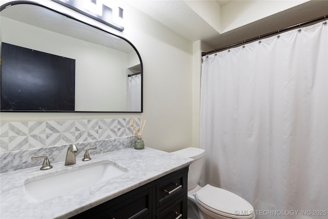 bathroom with toilet and vanity