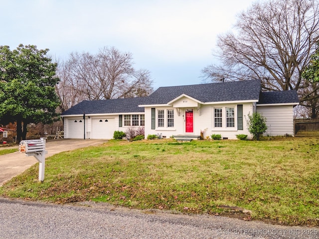 ranch-style home with a garage and a front yard