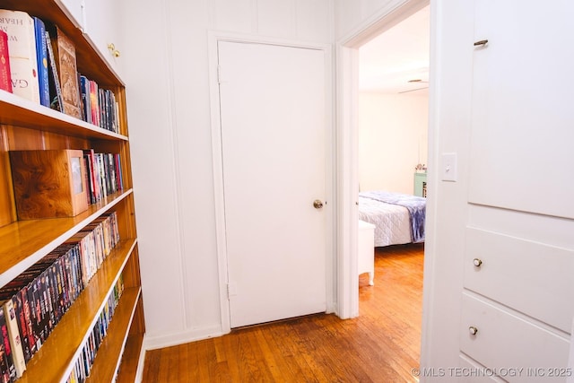 corridor featuring hardwood / wood-style floors