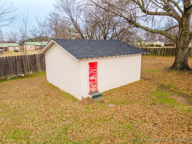 view of outdoor structure with a lawn