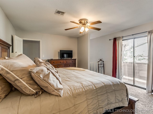 bedroom featuring ceiling fan, access to exterior, and carpet flooring