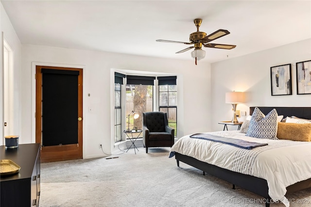 bedroom featuring a ceiling fan, carpet flooring, and visible vents