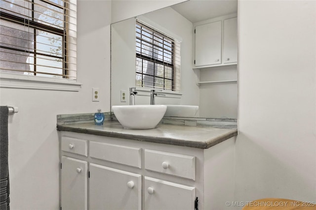 bathroom with a wealth of natural light and vanity