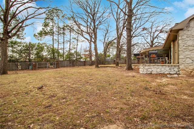 view of yard with a fenced backyard