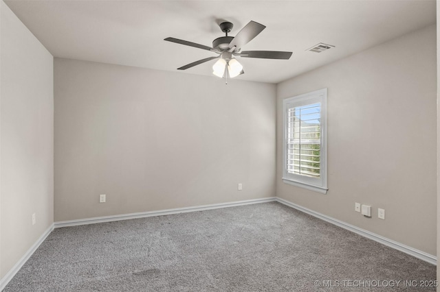 empty room with ceiling fan, baseboards, carpet, and visible vents