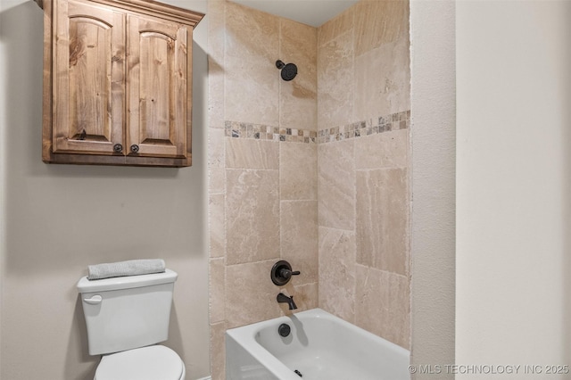 bathroom featuring shower / tub combination and toilet