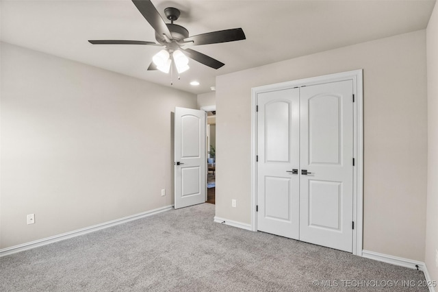 unfurnished bedroom with carpet, a closet, a ceiling fan, recessed lighting, and baseboards