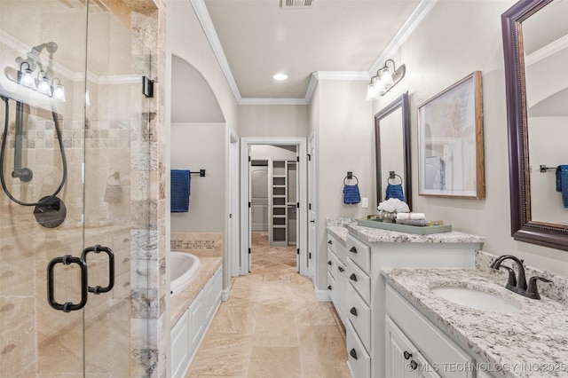full bathroom with a sink, ornamental molding, a shower stall, visible vents, and a garden tub