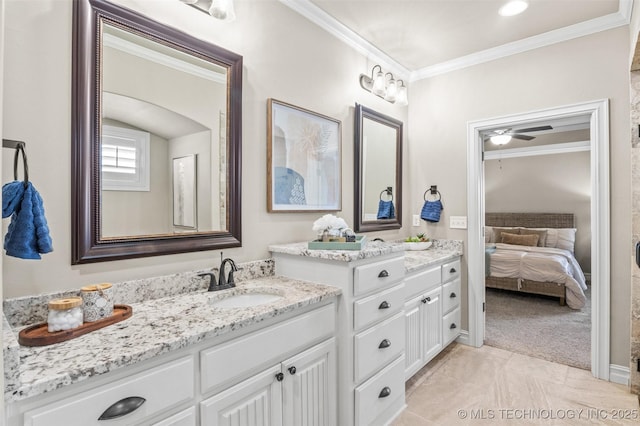 ensuite bathroom with crown molding, vanity, ceiling fan, and ensuite bathroom