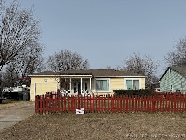 ranch-style house with a garage and a front lawn