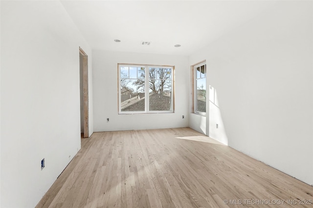 unfurnished room featuring light wood-type flooring