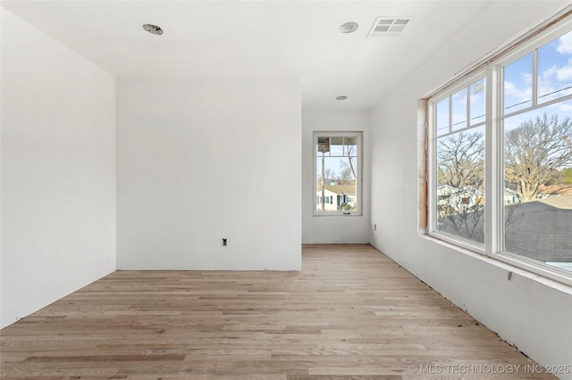 unfurnished room featuring light wood-type flooring