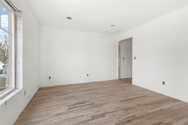 spare room with light hardwood / wood-style floors