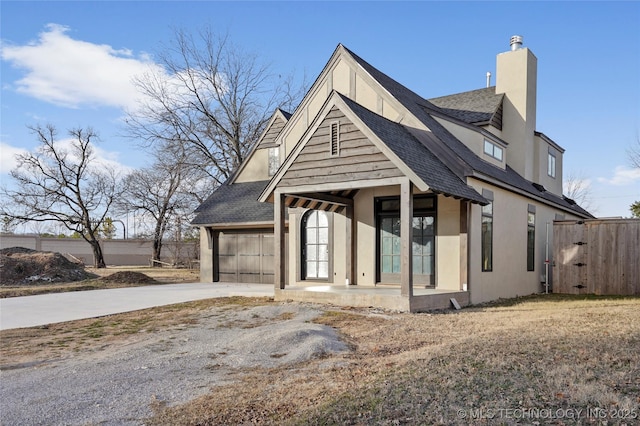 view of front of house with a porch and a garage