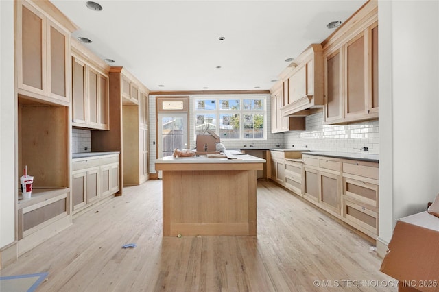 kitchen featuring light hardwood / wood-style floors, light brown cabinetry, and a center island