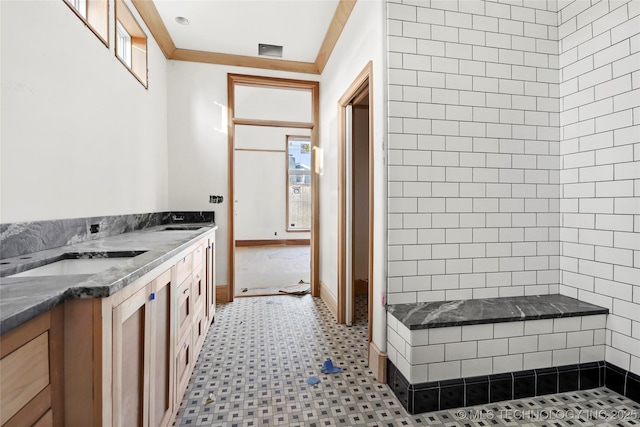 bathroom with vanity and crown molding