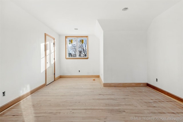 spare room with light wood-type flooring