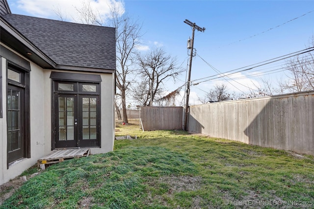 view of yard featuring french doors