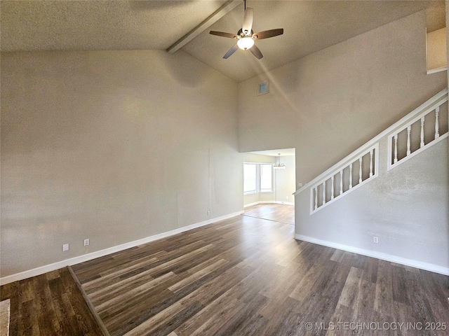 unfurnished living room featuring ceiling fan with notable chandelier, dark wood-type flooring, high vaulted ceiling, and beamed ceiling