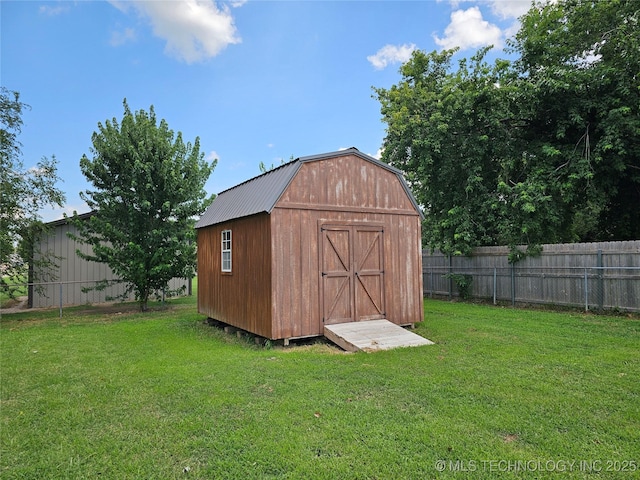 view of outdoor structure with a yard