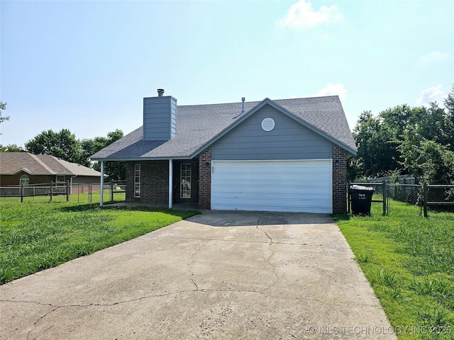 view of front facade with a front lawn and a garage