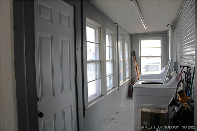 washroom featuring washer and clothes dryer