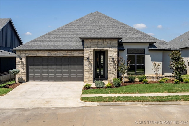 view of front of home with a garage and a front yard