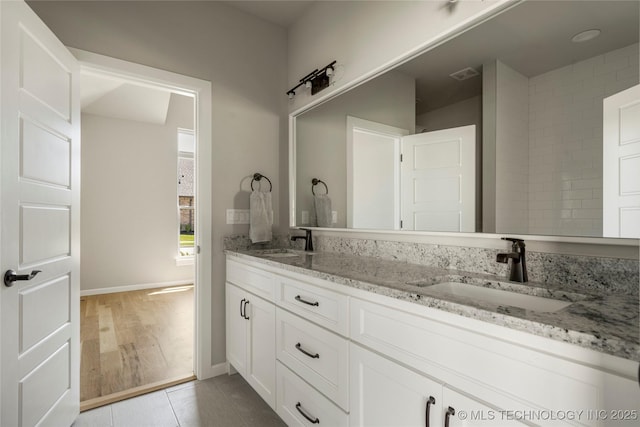 bathroom with vanity and tile patterned flooring