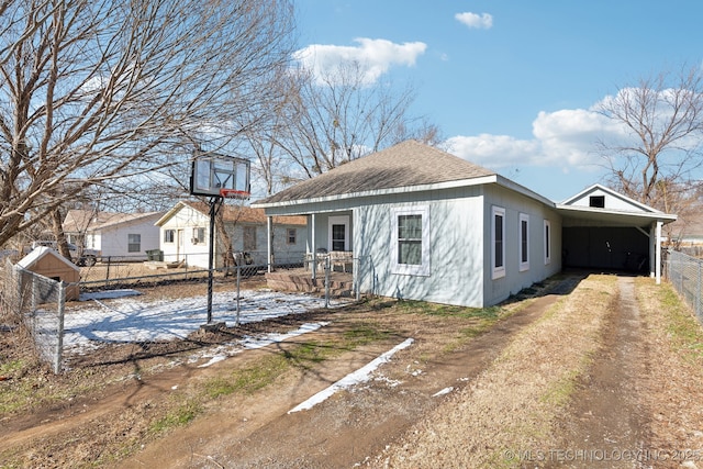 rear view of house with a carport