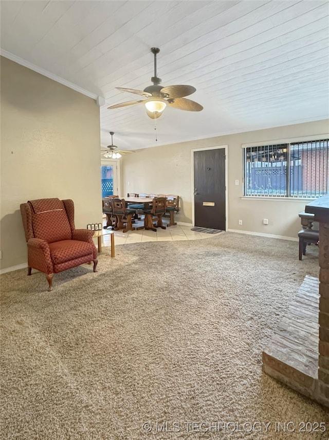 living room with ceiling fan, light colored carpet, and ornamental molding