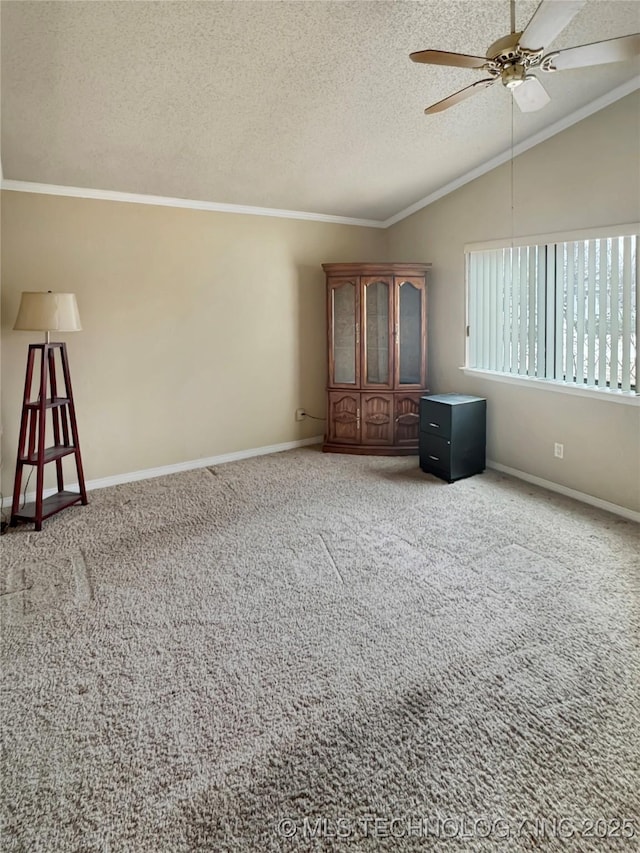 unfurnished bedroom with a textured ceiling, ceiling fan, carpet, and lofted ceiling